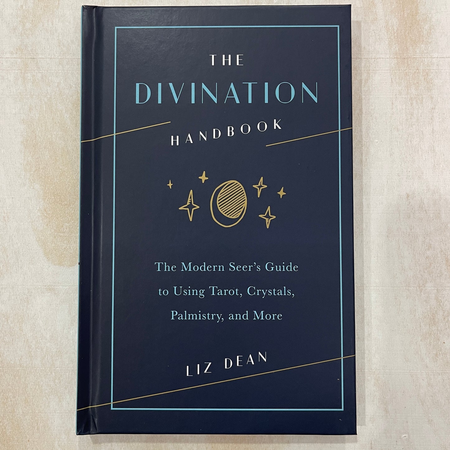 The Divination Handbook: The Modern Seer's Guide to Using Tarot, Crystals, Palmistry, and More